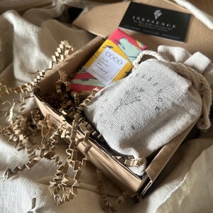 an open box with a book and some other items in it