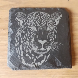 A Natural 4&quot; / 10cm Square Slate Coaster Engraved with a Cheetah&#39;s Head.
