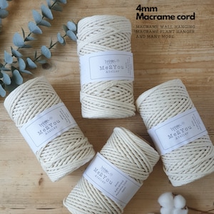 May include: Four spools of 4mm natural cotton macrame cord, each labeled "Me2You Atelier". The cord is ideal for macrame wall hangings, plant hangers, and other crafts.