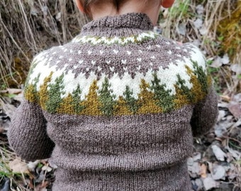 May include: A brown knit sweater with a high collar. The yoke features a white, green, and brown geometric design resembling trees. The sweater is made of a thick, textured yarn, suitable for cold weather. The child's sweater is seen from the back.