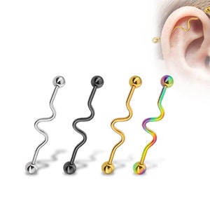 May include: Four different colored surgical steel body jewelry pieces. Each piece is a curved barbell with a ball on each end. The colors are silver, black, gold, and rainbow.