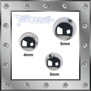 May include: Three silver metal balls, 3mm, 4mm, and 5mm in diameter. The balls are shiny and reflective.  Eternal Body Jewelry.