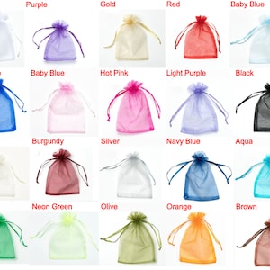 May include: Assortment of 20 colours of small organza bags, each bag is tied with a ribbon. Colours include white, purple, gold, red, baby blue, royal blue, hot pink, light purple, black, ivory, burgundy, silver, navy blue, aqua, green, neon green, olive, orange, and brown.