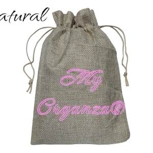 May include: A natural burlap drawstring bag with the text "My Organza&reg;" embroidered in pink.