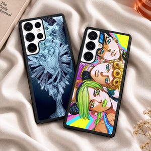 May include: Two rectangular smartphone cases with black frames. The left case features a blue and white monochromatic illustration of a character. The right case displays a colorful graphic print of three anime-style characters with green, blonde, and dark hair.