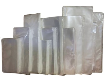 May include: A variety of clear plastic bags of different sizes stacked on top of each other.
