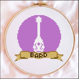 May include: A purple and white embroidery hoop with a white lute and the word "BARD" on a brown banner.