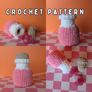May include: A crochet pattern image featuring a pink and white plush bottle design. The text "CROCHET PATTERN" is at the top. The design includes a bottle with a brown stopper and dice.