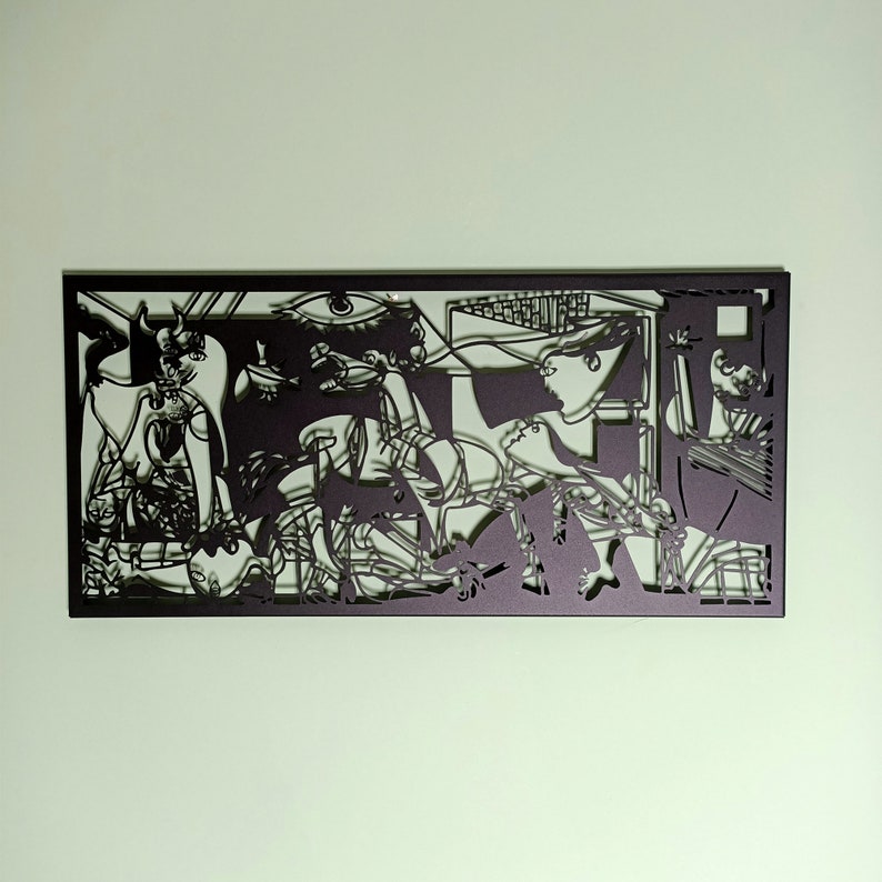May include: Black and white paper cut-out art depicting a scene with multiple figures. The art is framed in a black frame.