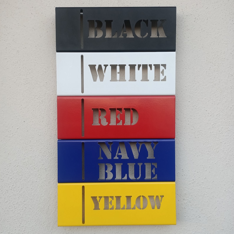 May include: Five metal rectangular signs with different colors and the words "BLACK", "WHITE", "RED", "NAVY BLUE", and "YELLOW" written in white.