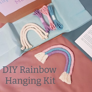 May include: DIY rainbow hanging kit with white rope, pink, blue and purple yarn. The kit comes in a box with the text "Happy Birthday Mum!" on the lid.