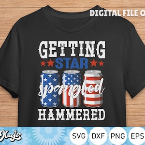 May include: Black t-shirt with a red, white, and blue American flag design. The text "Getting Star Spangled Hammered" is printed on the shirt.