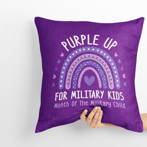 May include: Purple pillow with a rainbow and the text "Purple Up for Military Kids, Month of the Military Child".