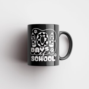 May include: Black ceramic mug with a white design that says "100 Days of School" with a donut and pencils.