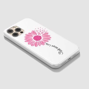 May include: White iPhone case with a pink sunflower design and the text "Faith Hope Love".