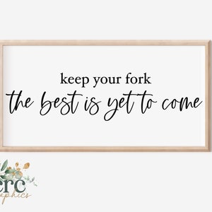 May include: A framed print with the text "keep your fork the best is yet to come" in black cursive font on a white background.