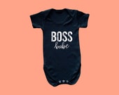 Black 100% cotton baby vest with "BOSS babe" design.