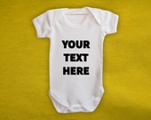 Personalised custom text baby vest in white. 100% Cotton. Multiple print colours and fonts available.