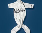 Unisex white baby romper with special side design “bristolian”. 100% cotton.
