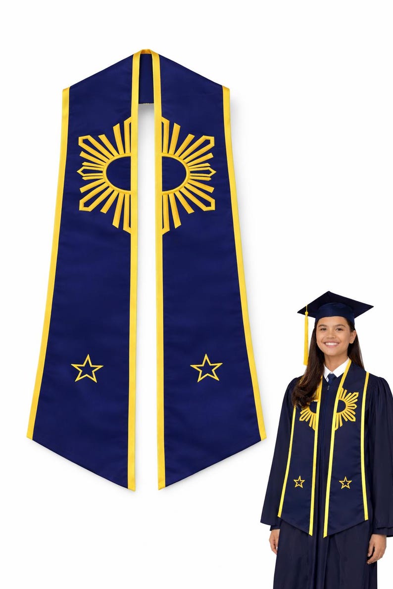 May include: A navy blue graduation stole with yellow trim and embroidered sunburst and star designs. The stole is displayed with a matching graduation gown and cap, creating a cohesive academic ensemble.
