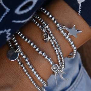 Gaia bracelet in silver-plated beads with a customizable charm. Sold individually, ideal for stacking. Several sizes available.