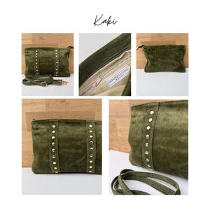 May include: Olive green suede clutch with gold-colored stud accents. The bag has a detachable shoulder strap and a zipper closure. The word "Kaki" is written in cursive at the top of the image. The interior of the bag is a light beige color.