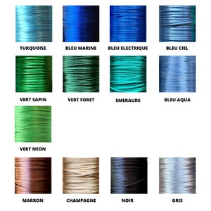 May include: A collection of 13 spools of waxed cotton cord in various colors, including turquoise, blue, green, emerald, neon green, brown, champagne, black, and gray. Each spool is labeled with the color name in French.