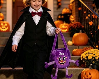 May include: A purple plush trick-or-treat bag with a cartoon face, the name Joe printed on the front, and dangling arms and legs. The bag features a handle and is held by a person wearing a black vampire cape, white shirt, and red bow tie.