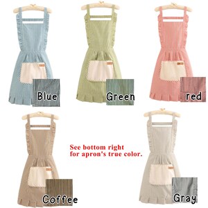 May include: Aprons in blue, green, red, coffee, and gray, each with vertical stripes and a large front pocket. The aprons have ruffled edges and are displayed on wooden hangers. The text "See bottom right for apron's true color" is visible.
