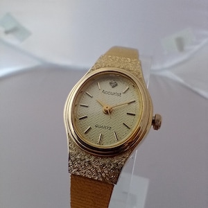 Accurist Women&#39;s Quartz Watch: Gold Bracelet, Petite Oval Face
