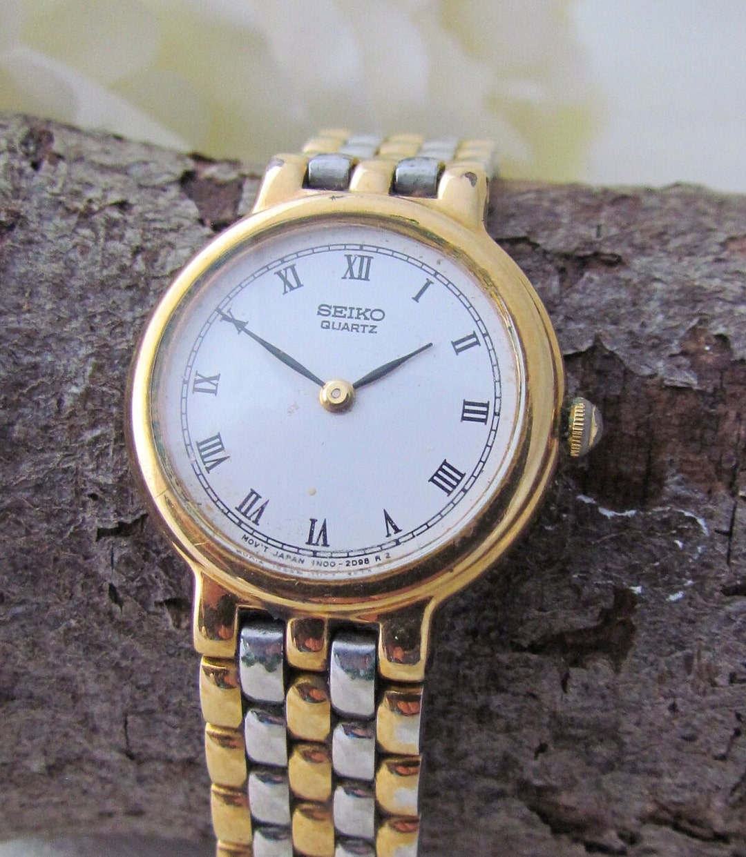Montre à quartz Seiko vintage bracelet bicolore or et acier, chiffres  romains France