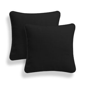 May include: Two black square throw pillows with a subtle sheen. The pillows are made of a soft, durable fabric and are perfect for adding a touch of sophistication to any room.