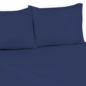May include: Two navy blue pillowcases on a navy blue fitted sheet.