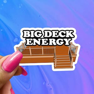 May include: A white sticker with a cartoon illustration of a wooden deck with railings and stairs. The text "BIG DECK ENERGY" is printed in black letters on the sticker.
