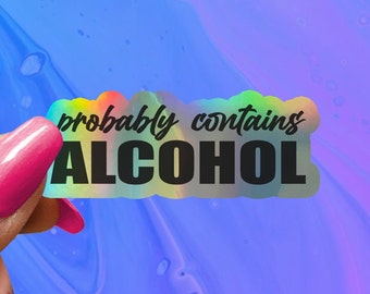 May include: A holographic sticker with a rainbow background and black text that reads "probably contains ALCOHOL".