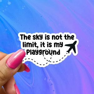 May include: White sticker with black text and a small airplane graphic. The text reads "The sky is not the limit, it is my playground."