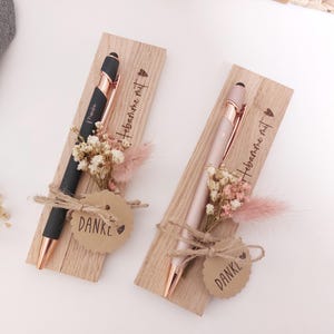 May include: A rustic wooden sign with the text "Welcome to our home" in white lettering. The sign features a distressed finish and a simple, inviting design, perfect for a front porch or entryway.