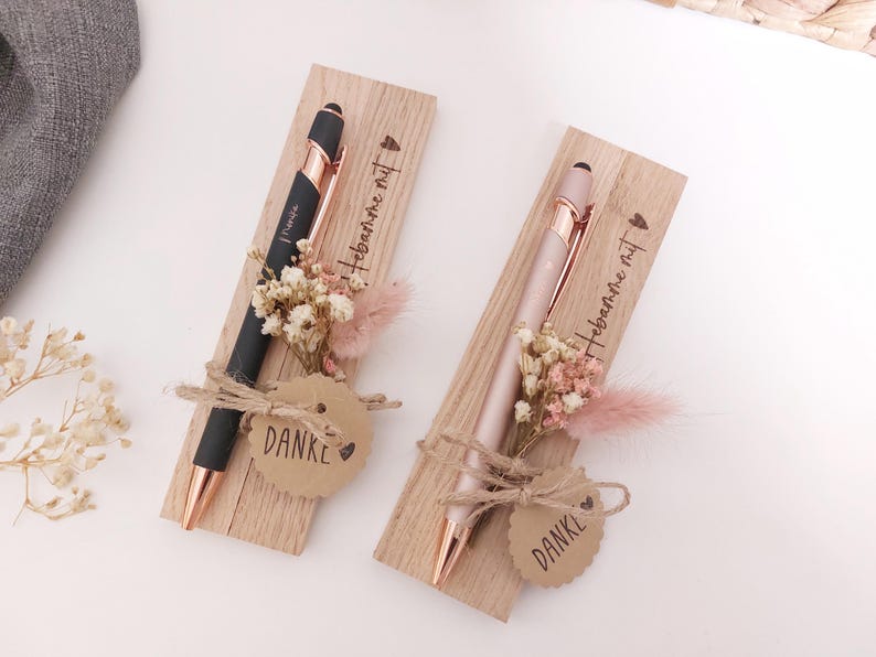May include: A rustic wooden sign with the text "Welcome to our home" in white lettering. The sign features a distressed finish and a simple, inviting design, perfect for a front porch or entryway.