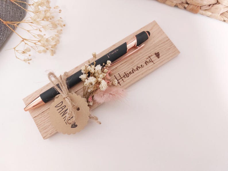 May include: A rustic wooden sign with the text "Welcome to our home" in white lettering. The sign features a distressed finish and a simple, inviting design, perfect for entryway decor.