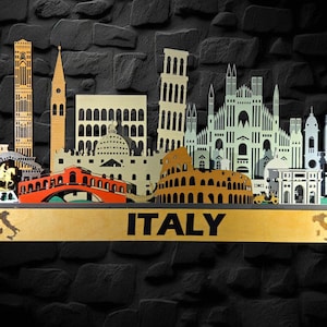 May include: A wooden Italy-themed decorative piece featuring iconic landmarks like the Leaning Tower of Pisa, the Colosseum, and the Duomo. The word "ITALY" is displayed on a gold-colored base, with a black stone background.