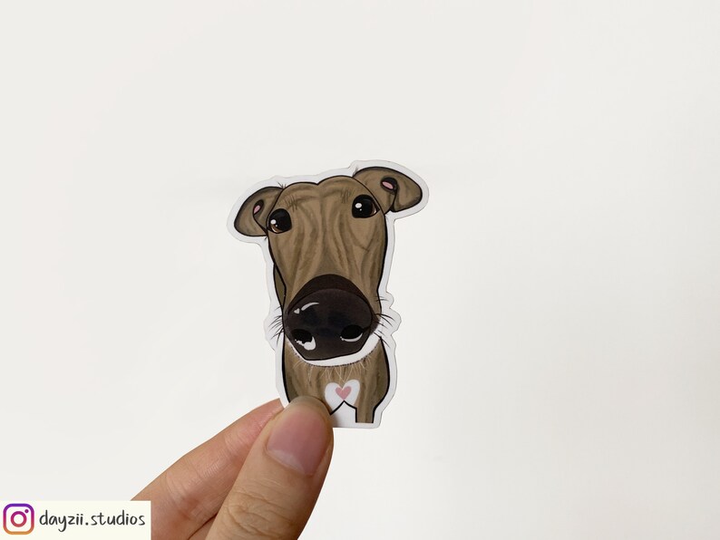 May include: A brown and white cartoon illustration of a dog's head with a pink heart on its chest. The dog is looking directly at the viewer.