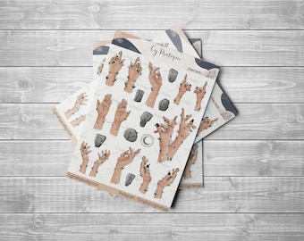 May include: A set of stickers featuring illustrations of hands with vines and crystals, along with runes and other symbols. The stickers are on a white background with a light brown border. The text "Cy Pratique" and "Magic Hands" is visible on the stickers.