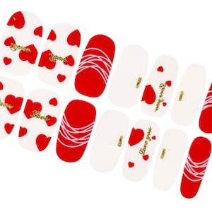 May include: Set of 10 red and white nail stickers with heart and swirl designs. Some stickers feature the text "Love you".