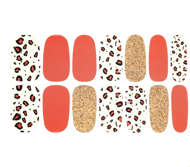 May include: Nail art strips featuring a variety of designs. The strips include solid coral, gold glitter, and white with red leopard print patterns. These nail art strips are designed for easy application and a stylish manicure.