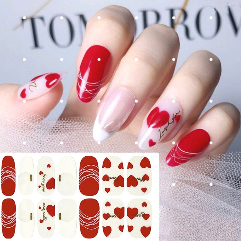May include: Nail art stickers with a red and white design featuring hearts and the text "Love you".