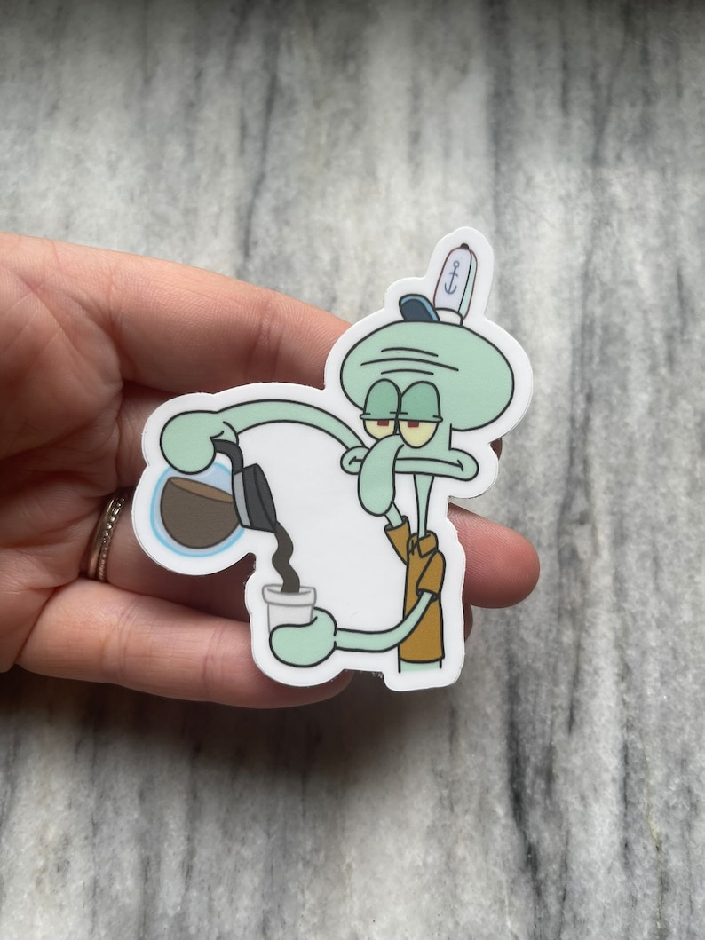May include: A sticker featuring Squidward from Spongebob Squarepants, pouring coffee into a cup. Squidward is light green with a brown shirt and a blue hat. The coffee is black, and the cup is white.