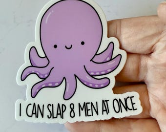 May include: A sticker featuring a cartoon octopus in shades of purple with a smiling face and eight tentacles. The sticker has the text "I CAN SLAP 8 MEN AT ONCE" in black, bold letters.