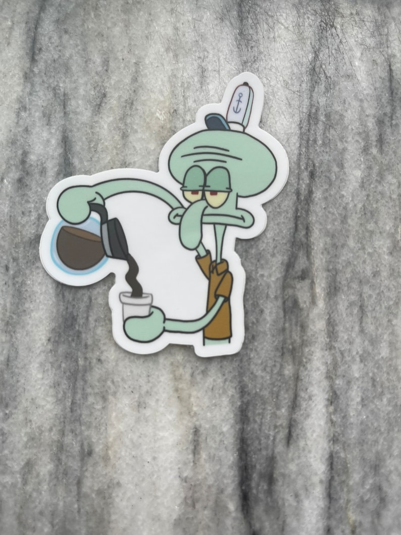 May include: A sticker featuring Squidward from Spongebob Squarepants pouring coffee into a cup. Squidward is depicted in his usual grumpy expression, wearing a brown shirt and a sailor hat. The sticker has a white border and is set against a gray background.
