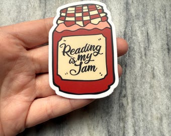 May include: A red and white sticker with a jar of jam that says "Reading is my jam".