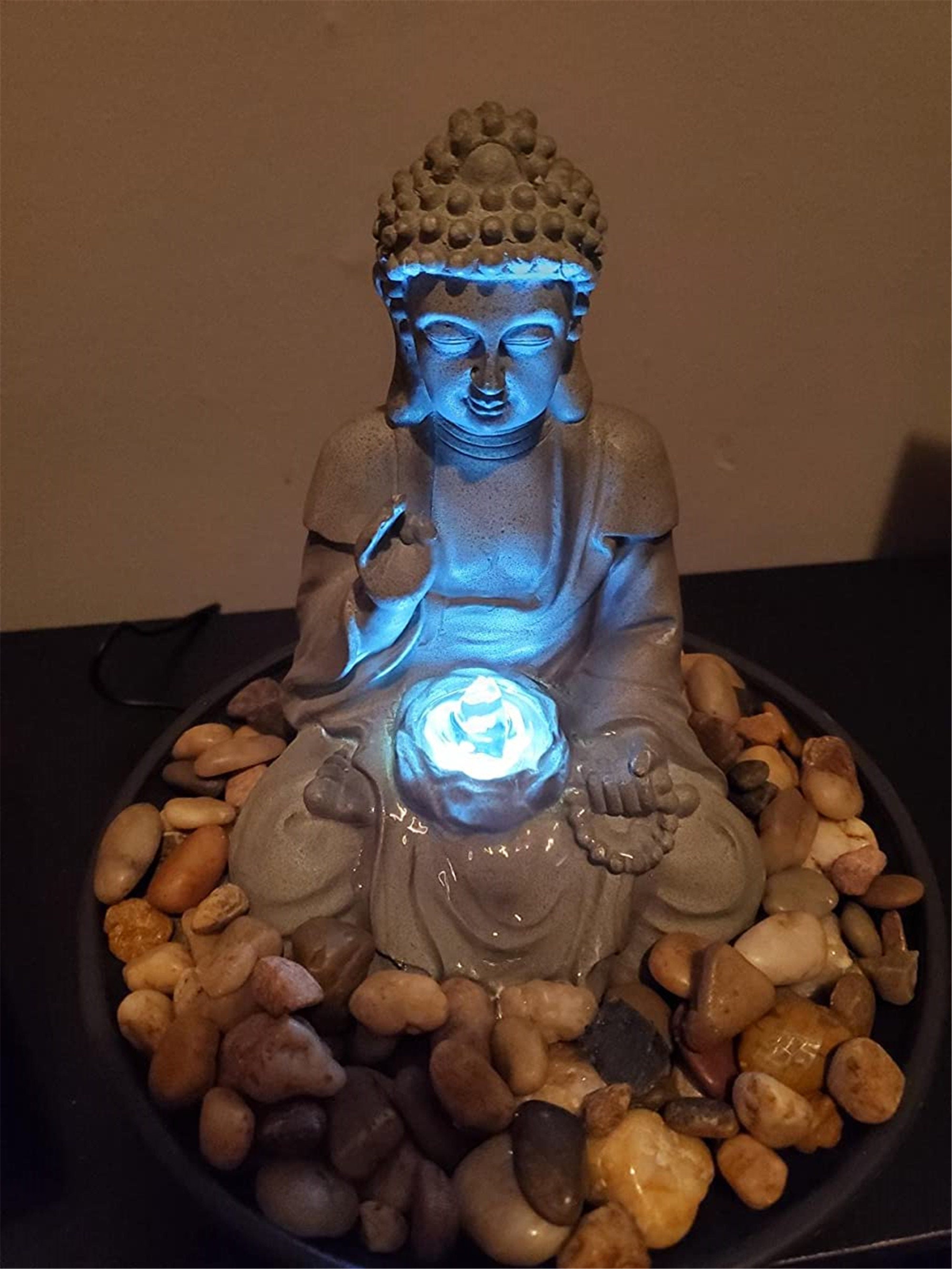 resin meditating buddha on column patio fountain with led light